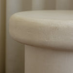 Close-up of Clay Duvet showing a subtle, fine grain across its tactile surface and softly rounded edge.