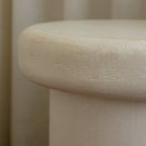 Close-up of Clay Duvet showing a subtle, fine grain across its tactile surface and softly rounded edge.