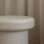 Close-up of Clay Duvet showing a subtle, fine grain across its tactile surface and softly rounded edge.