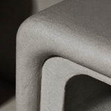 Close-up of Clay Duvet showing a subtle, fine grain across its tactile surface and softly rounded edge.