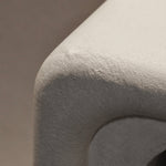 Close-up of Clay Duvet showing a subtle, fine grain across its tactile surface and softly rounded edge.