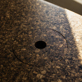 Close-up of Espresso cork showing its tactile, mottled texture and satin finish reflecting natural light.