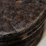 Close-up of Espresso cork showing its tactile, mottled texture and satin finish reflecting natural light.