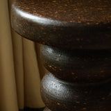 Close-up of Espresso cork showing its tactile, mottled texture and satin finish reflecting natural light.