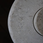 Close-up of the honed Limestone Portland Side Table top, with fossil-like inclusions and subtle grey-beige tonal variation.