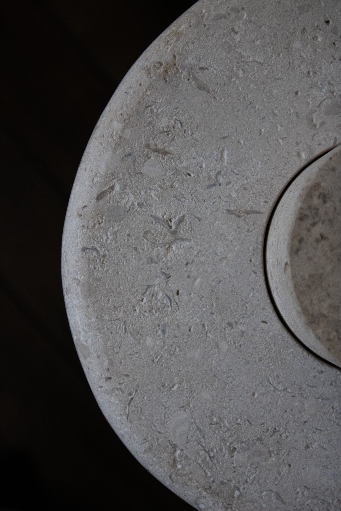 Close-up of the honed Limestone Portland Side Table top, with fossil-like inclusions and subtle grey-beige tonal variation.