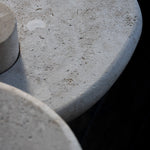 Close-up of the honed Limestone Portland Side Table top, with fossil-like inclusions and subtle grey-beige tonal variation.
