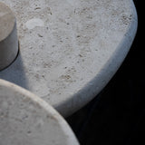 Close-up of the honed Limestone Portland Side Table top, with fossil-like inclusions and subtle grey-beige tonal variation.