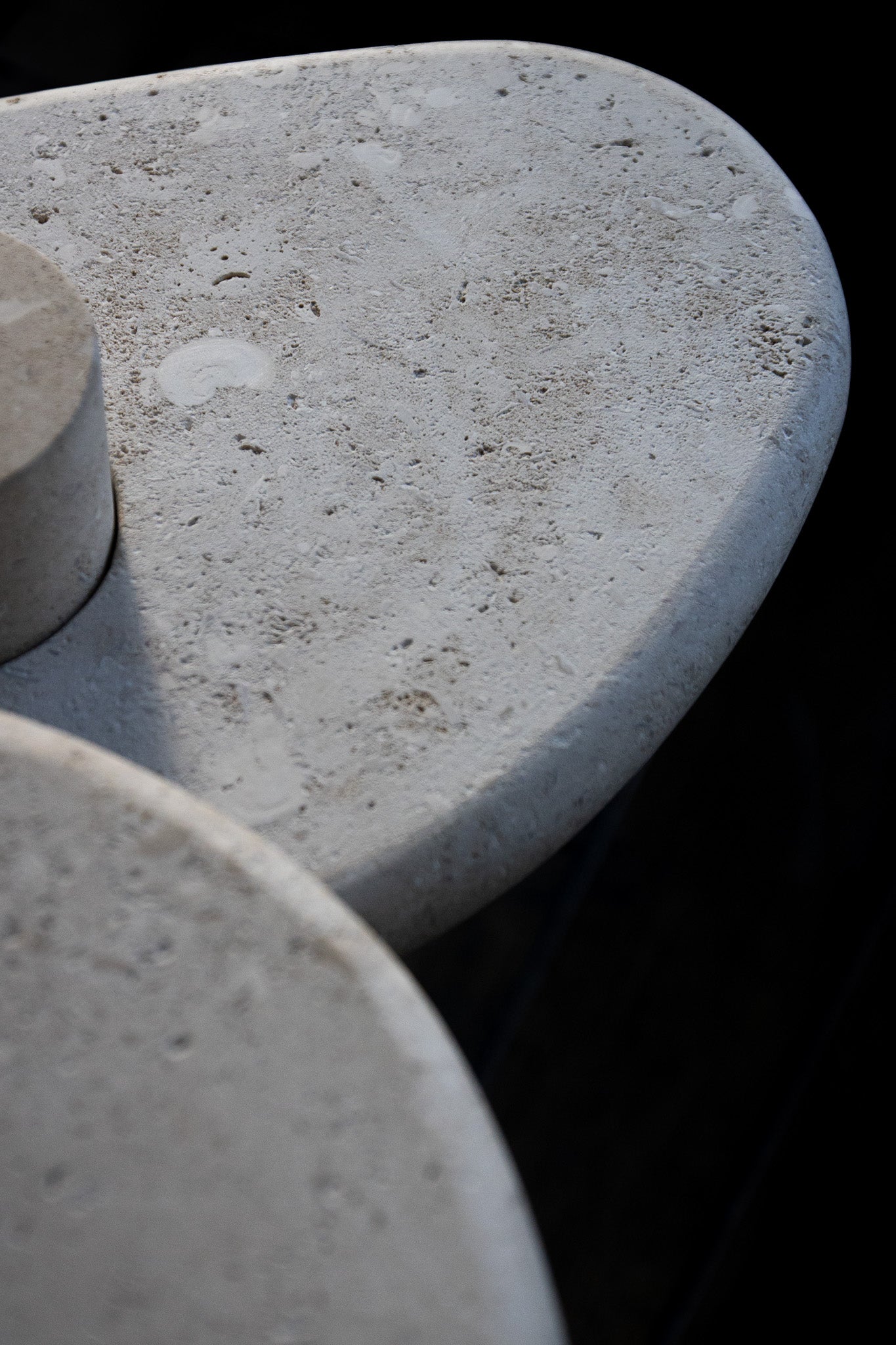 Close-up of the honed Limestone Portland Side Table top, with fossil-like inclusions and subtle grey-beige tonal variation.