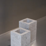 Two honed Limestone Portland Cube Holders with open tops and softly textured, pale grey-beige surfaces.