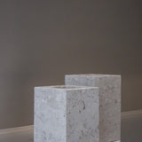 Two honed Limestone Portland Cube Holders with open tops and softly textured, pale grey-beige surfaces.