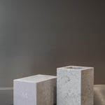 Two honed Limestone Portland Cube Holders with open tops and softly textured, pale grey-beige surfaces.