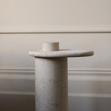 Honed Limestone Portland Side Table with an organically shaped tabletop and cylindrical pedestal, in pale grey-beige stone.