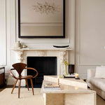 Angular Travertino Classico CC marble coffee tables with warm-toned veining in a natural soft interior.