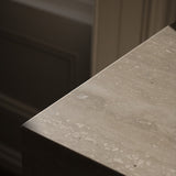 Close-up of Travertino Classico VC showing soft beige veining, natural pores and tonal variation.