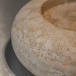 Close-up of Travertino Classico CC showing soft beige veining, natural pores and tonal variation.