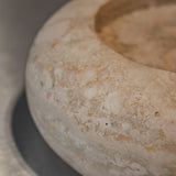 Close-up of Travertino Classico CC showing soft beige veining, natural pores and tonal variation.