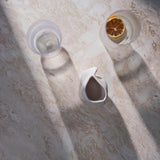 Close-up of Travertino Classico CC showing soft beige veining, natural pores and tonal variation.